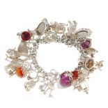 A silver charm bracelet. The curb-link bracelet with heart-shape padlock clasp, suspending a total