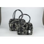 LULU GUINNESS - two black canvas handbags. To include one large and one small Carmella bag