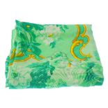 ESCADA - two silk scarves. The first of predominantly green tones, depicting flowers and leaves,