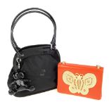 Four designer handbags. To include a Moschino black canvas bag with patent details and matching