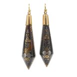 A pair of late Victorian tortoiseshell pique earrings. The ear pendants of pear-shape, inlaid with