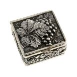 A silver snuff box embossed with a bunch grapes. Of square design, the hinged lid embossed with vine