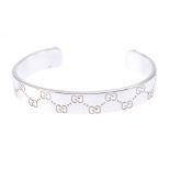 GUCCI - a bangle. The open bangle with 'GG' pattern to the full-bangle. Signed Gucci. Inner