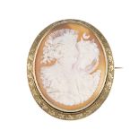 A cameo brooch. The carved shell depicting the gods Day and Night with an eagle and owl, to the