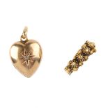 A locket and ring. The locket of heart-shape set with a single diamond to the front, the reverse