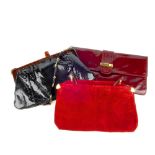 Three vintage evening handbags. To include a red suede cross body bag labelled Charles Jourdan, a