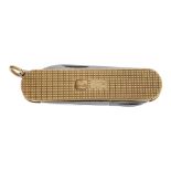 A 9ct gold cased penknife. The case of crosshatched engine turned pattern, with decorative hallmarks