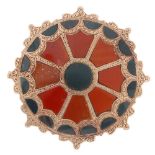 A Scottish agate brooch. Of circular outline, the eight red agate segments with semi-circular