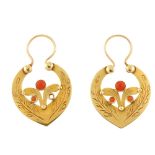 A pair of coral earrings. Each designed as a pointed horseshoe shape, a branched motif within and