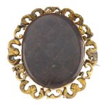 A late Victorian hand painted memorial brooch. Of oval outline, the glazed woven hair panel to the