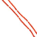 A coral bead necklace. The single row of spherical coral beads, measuring 0.4cms, with small metal