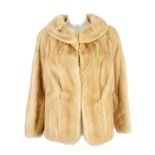 A tourmaline mink three-quarter length jacket. Featuring a round collar, hook and eye fastenings and