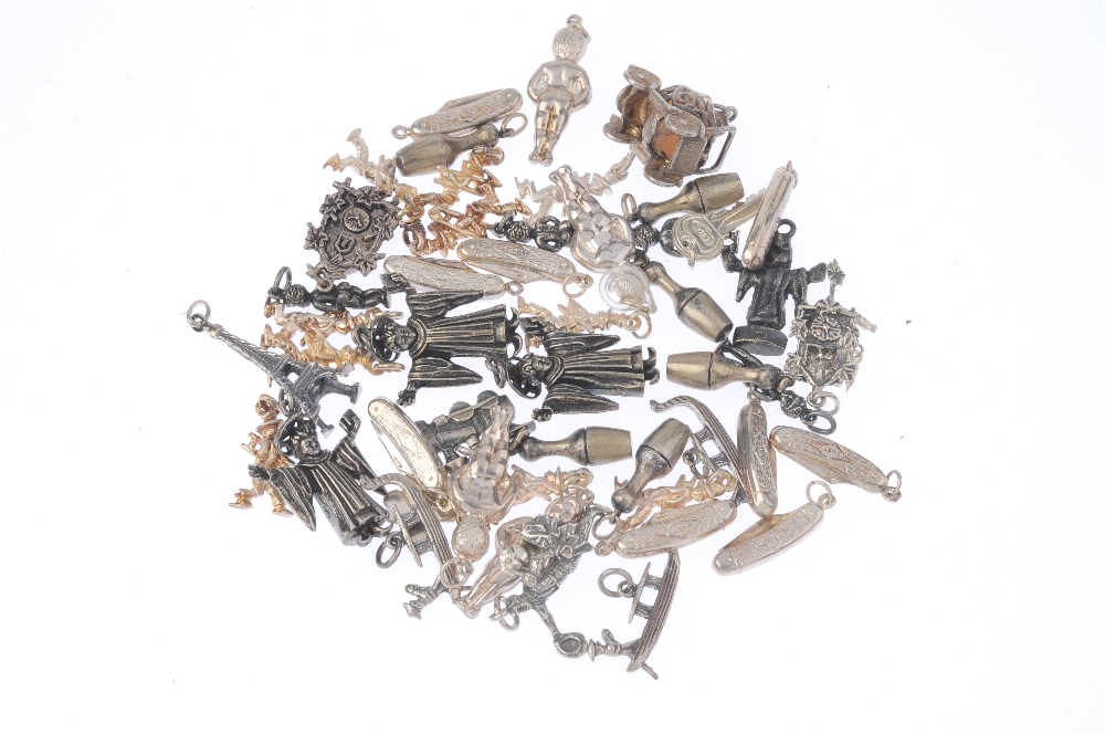 A selection of silver and white metal charms. To include a carriage, a cuckoo clock, multiple - Image 2 of 2