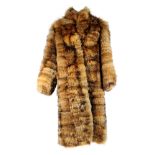 A full length red fox tail pieced fur mens coat. Featuring hook and eye fastenings and two