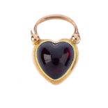 A garnet cabochon memorial padlock clasp. Of heart-shape outline, set with a heart-shape garnet