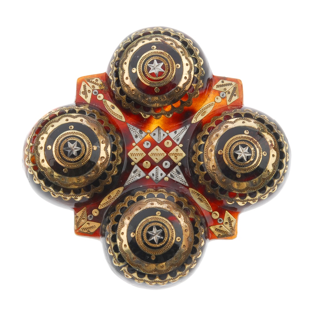 A late 19th century tortoiseshell pique brooch. Of quatrefoil design, the four domed circles