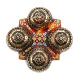 A late 19th century tortoiseshell pique brooch. Of quatrefoil design, the four domed circles