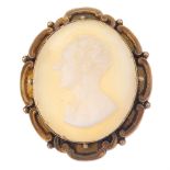 A shell cameo and horse-shoe bangle. The cameo of pale colour shell, depicting a man in profile,