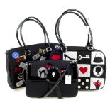 LULU GUINNESS - three black canvas handbags. To include a bowling bag featuring a ticket design, a