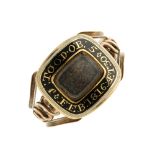 A late Georgian gold enamel memorial ring. The rectangular panel with black and white enamel