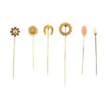 A selection of stickpins. To include one set with an inverted pear-shape coral piece, together