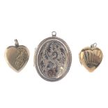 Three lockets. To include two mid 20th century heart-shape 9ct gold back and front lockets, together