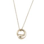 TIFFANY & CO. - an Elsa Peretti pendant. Designed as a graduated circle suspended from a fine