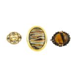 A selection of costume jewellery items. To include an oval-shape tiger's eye pendant, with rope-