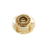 PANDORA - a gold charm. The colourless glass bead with white swirl patterns, to the gold inner rivet