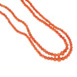 A coral two row necklace. The two rows of graduated bouton shape coral beads, measuring 0.3 to 0.