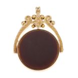 A Victorian 9ct gold swivel fob. Of circular design, with carnelian to one side and bloodstone to