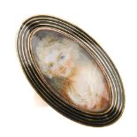 A late Georgian miniature portrait ring. The navette shape ring with banded black enamel surrounding