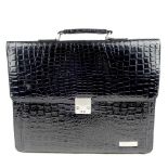 A selection of items. To include a patent faux crocodile embossed briefcase, with three compartments