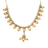 A gilt metal and paste necklace. The figaro-link chain to the line of circular colourless pastes and