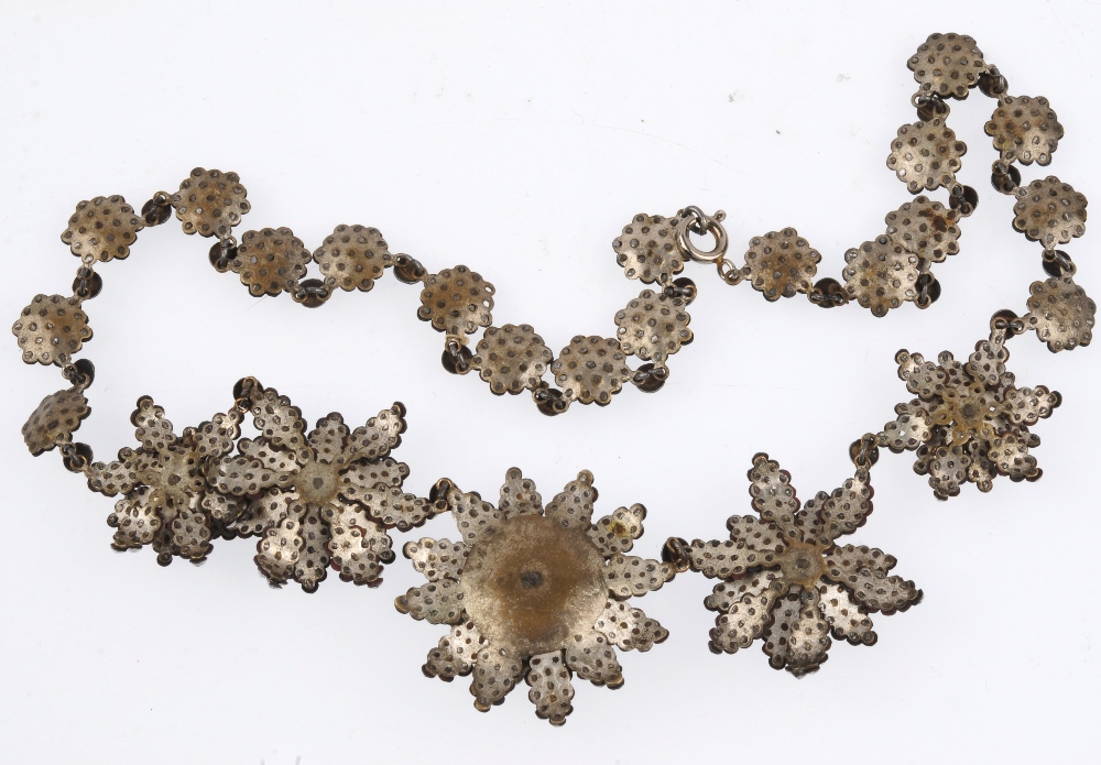 An early 19th century cut steel necklace. Designed as five cut steel flowers, with layered petal - Image 3 of 3