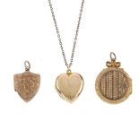 Four 9ct back and front lockets. To include one of oval outline, engraved with abstract scrolling