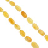 A modern natural amber necklace. Designed as a graduated row of twenty-eight oval-shape natural