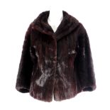 A dyed china weasel fur short jacket. Featuring a shawl collar, hook and eye fastening and two