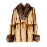 A sheared coney fur jacket with grey fox fur collar and cuffs. Featuring a lapel collar, a laser