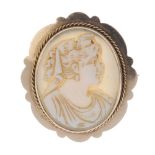 A shell cameo brooch. Depicting an aristocratic lady in profile, to the rope-twist surround and