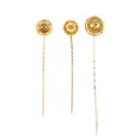 Four late 19th century stickpins. Three of circular outline, the fourth oval-shape, all set with a