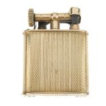 A 9ct gold lighter. Designed as a square shape with curved sides with banded engine turned design