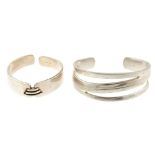 Three items of designer jewellery. The first a Pandora ring, the raised collet-setting with