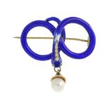 A mid Victorian gold enamel and pearl snake memorial brooch. The blue enamel snake coiled into a