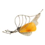 A selection of natural amber jewellery. To include an oval shape natural amber cabochon brooch, a