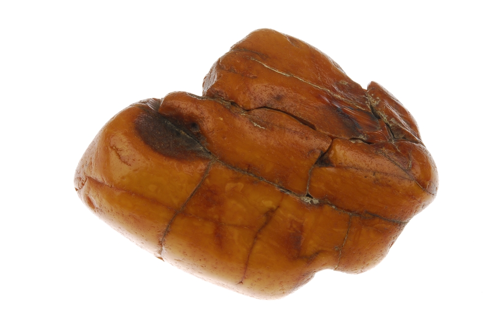 An amber boulder. The boulder of roughly oval shape with visible deep natural pits and fractures. - Image 2 of 4