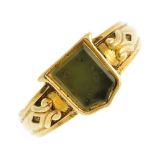 A late 19th century gold green hardstone intaglio ring. The shield shape green hardstone with