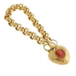 A mid 19th century gold bracelet with carved coral padlock clasp. The broad link belcher chain, with