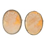 Two shell cameo brooches. Both of oval-shape outline, the shell cameos carved to depict the side