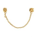 PANDORA - a gold safety chain charm. The chain with circular terminals embossed with flower shape